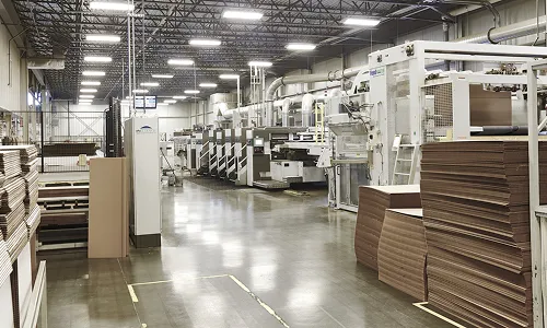 Interior of a corrugated packaging facility with production equipment