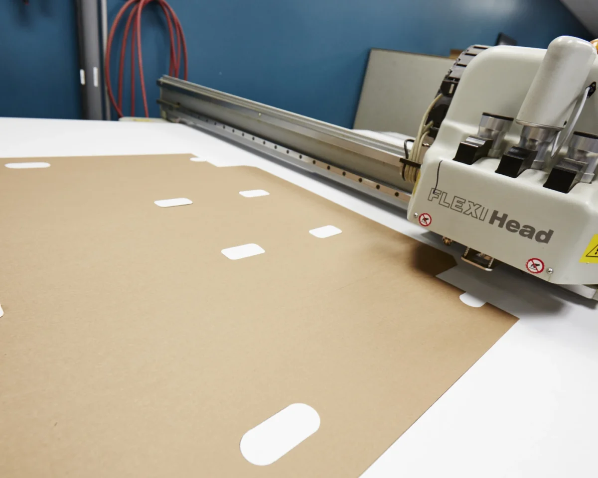 Corrugated sheets moving through a production machine