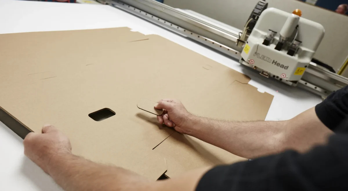 Person cutting corrugated cardboard 